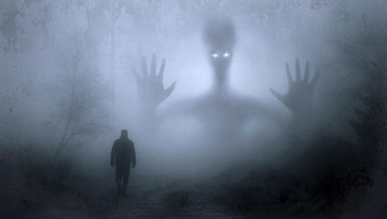 Ghostly figure in foggy forest — the dread of horror