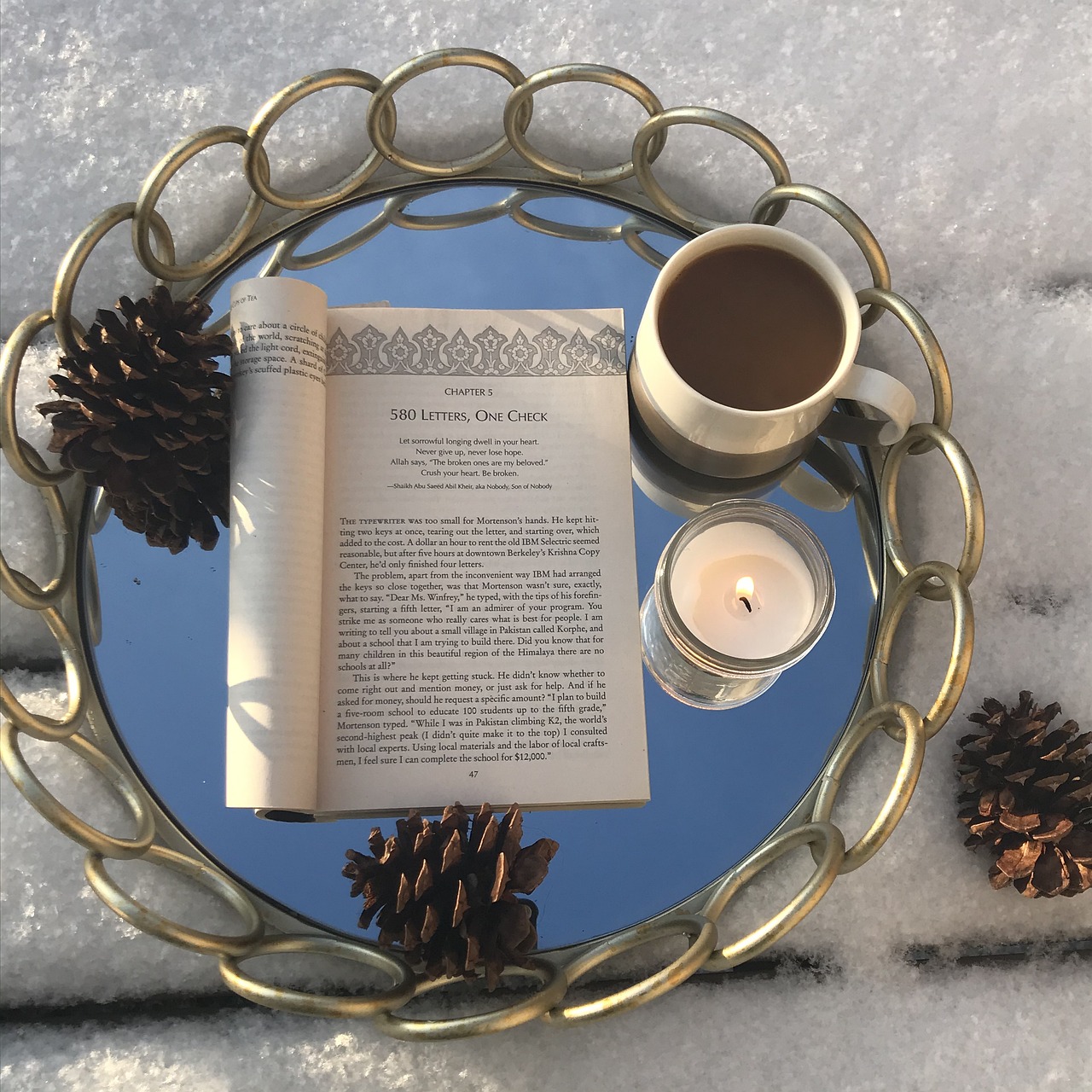 Book and coffee in a cozy winter setting