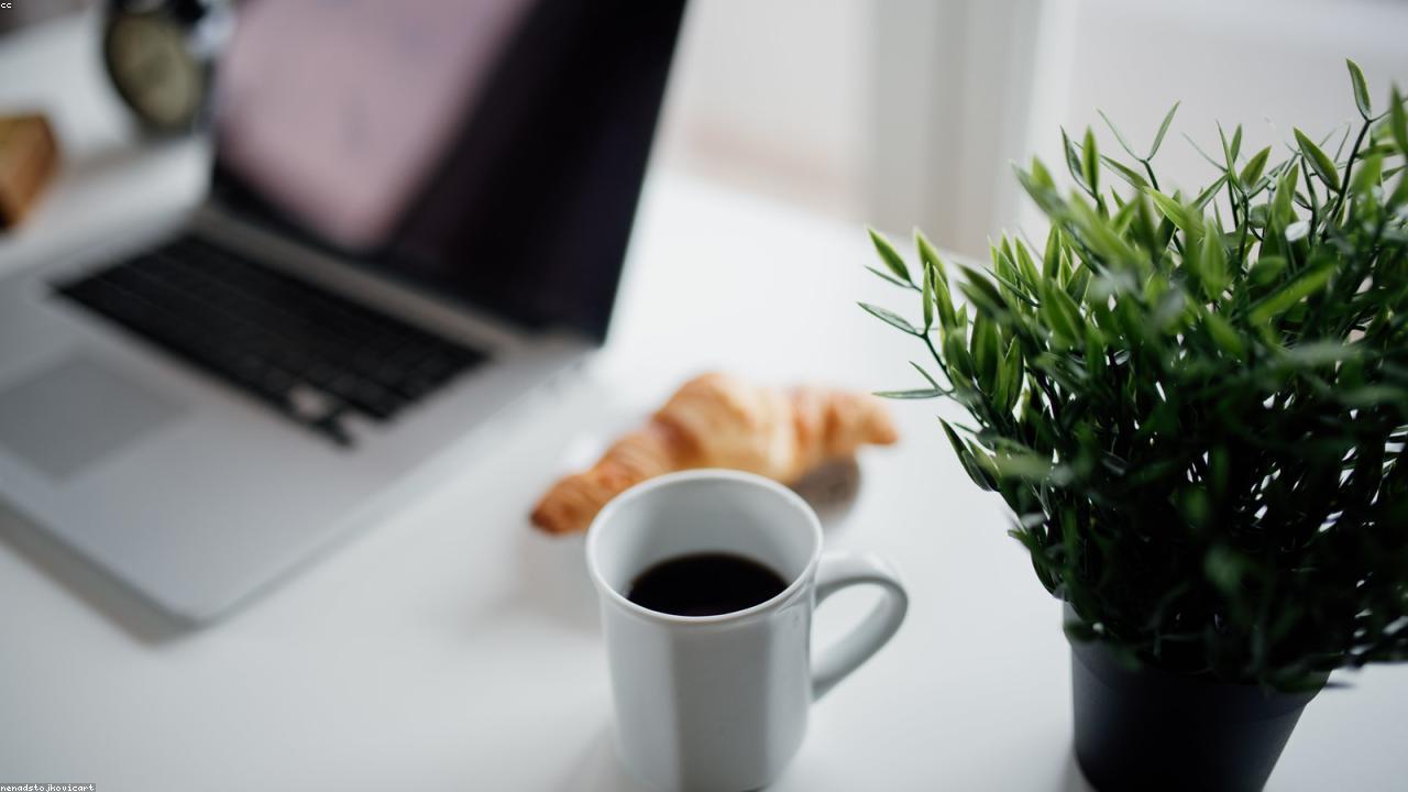 Coffee and a notebook on a desk — the ritual of crafting your opening