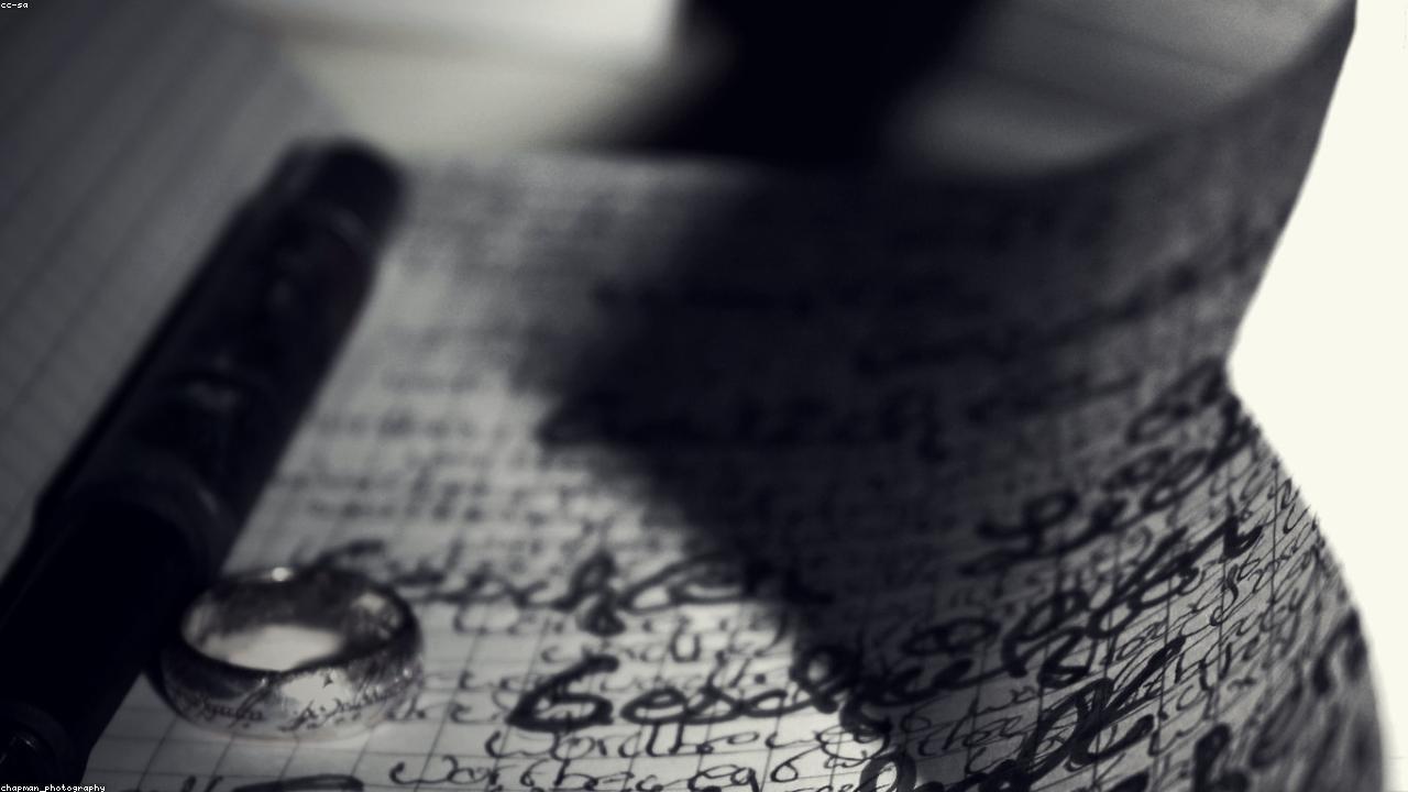 Writer sketching character notes in a notebook