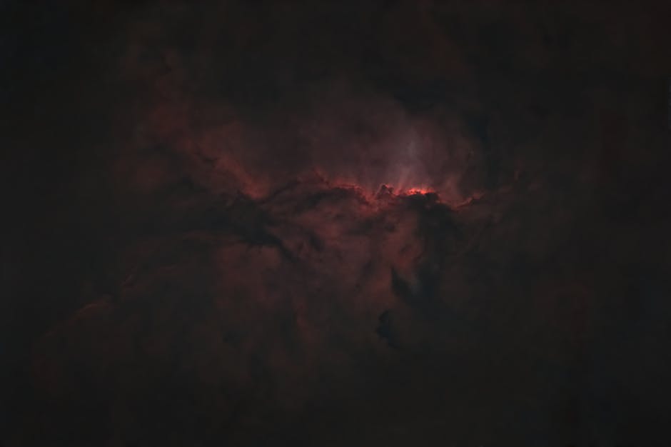 Mysterious and moody abstract art resembling a nebula with dark and moody tones.