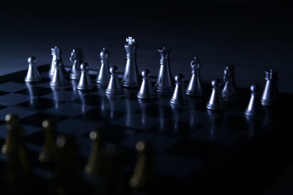 Moody chess set with dramatic lighting, highlighting strategic gameplay focus.