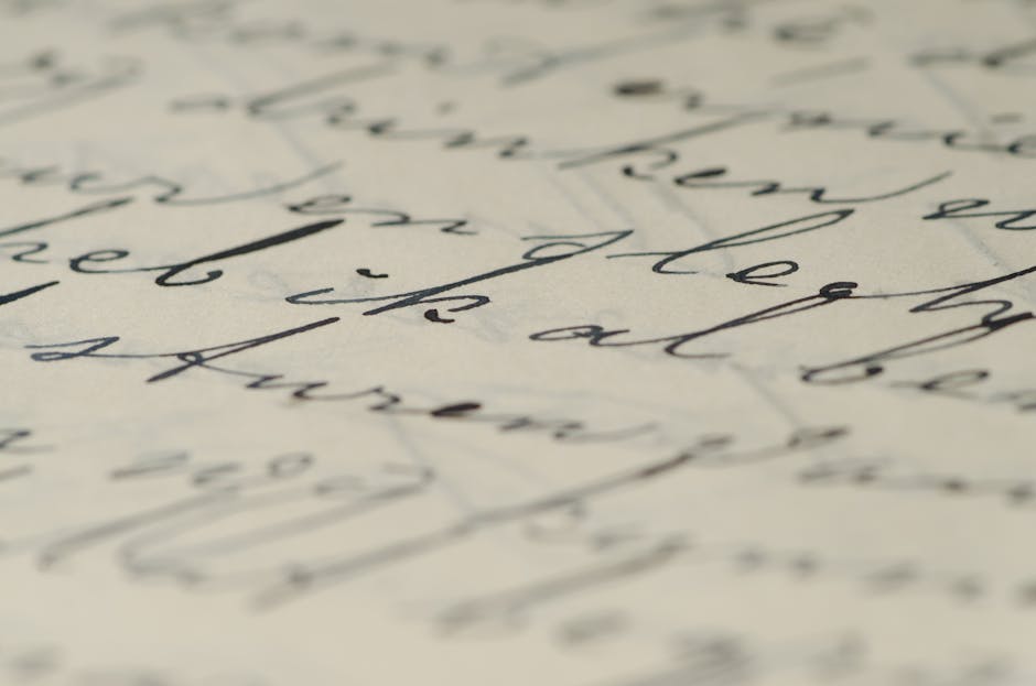Close-up of elegant handwritten calligraphy on paper showcasing fine ink script.